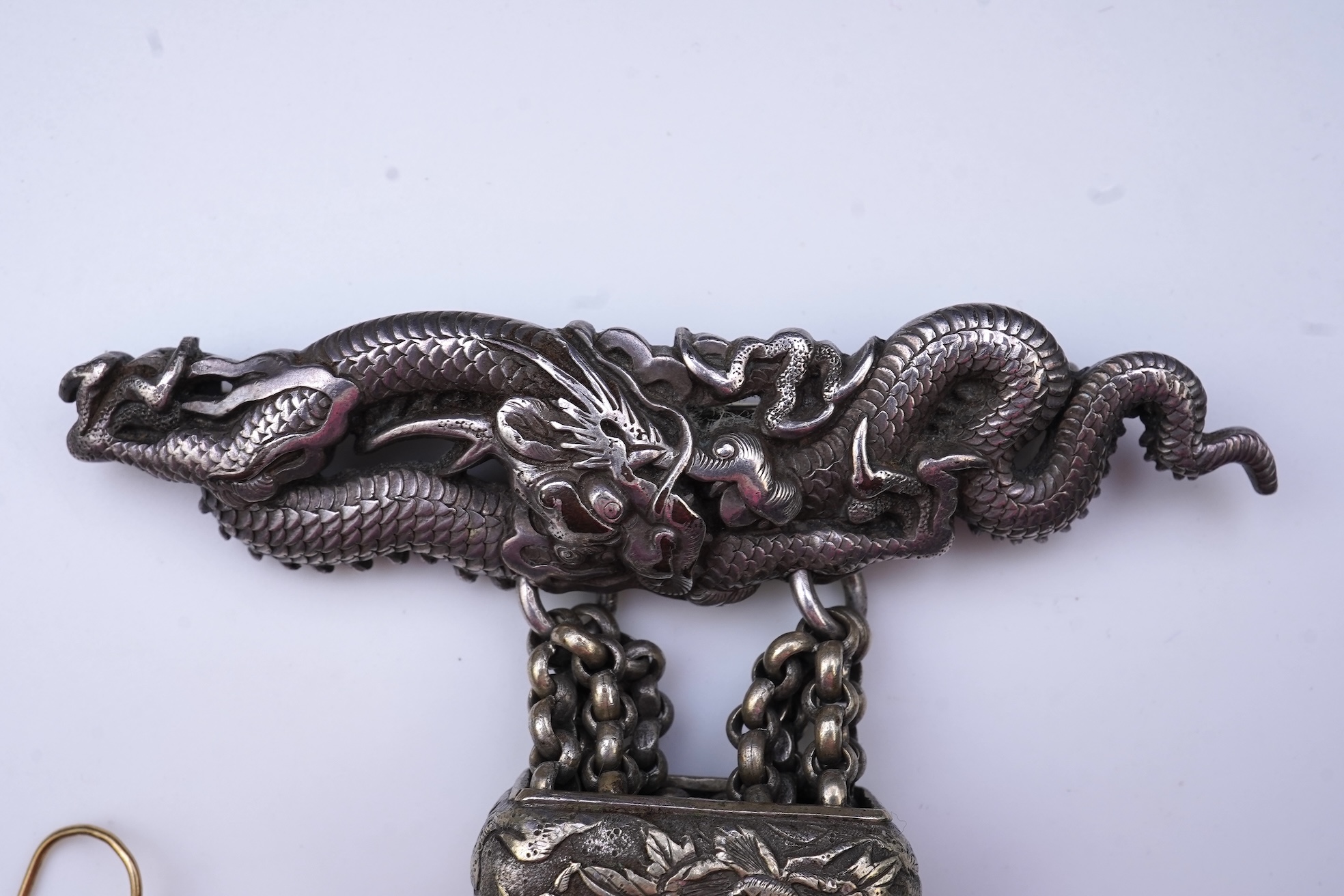 A chatelaine and a pair of serpentine bead earrings